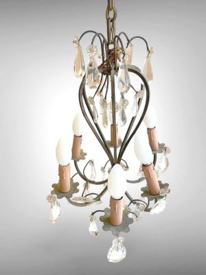 a small chandelier with a heart shaped light hanging from it