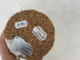 a person holding a cookie with stickers on it