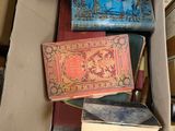 a box full of books sitting on top of a table
