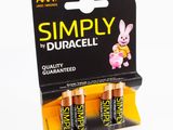 three aa batteries in a display box on a white background