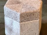 a small stool made out of concrete blocks on the floor