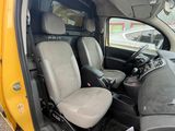 a yellow truck with two seats in the back of it