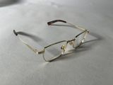 glasses on a table with a white table cloth and a pair of glasses