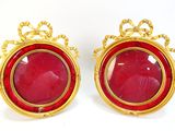 pair of red glass and gold earrings with a crown design