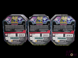 three packs of pokemon trading cards are shown on a black background