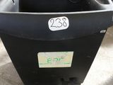 a black trash can with a number on it in a garage