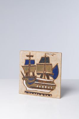 an image of a small wooden plaque with a ship on it