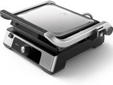 an image of a black and silver sandwich maker on a white background