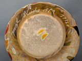 a close up of a vase with writing on it