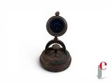 a small metal object with a ring on it