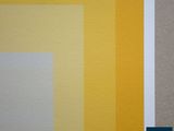 a close up of a yellow and white wall with a blue border
