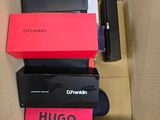 two boxes of electronic devices are stacked on top of each other