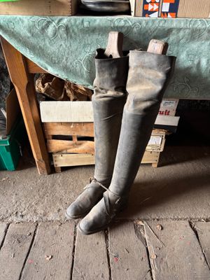 a pair of boots that are sitting on a wooden floor