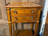 an image of a wooden table with two drawers on top of it