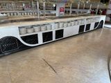 a picture of a restaurant kitchen with many dishes on the counter