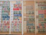 an open book with stamps on it on a table