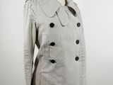 a white and black striped jacket on a mannequin mannequin mannequin mannequin mannequin mannequin mannequin mannequin
