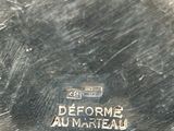 a close up of a silver plate with a logo on it