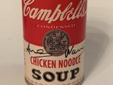 campbell ' s chicken noodle soup in a can on a white surface
