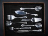 a picture of a display of silverware in a wooden box