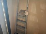 a ladder leaning up against a wall in a room