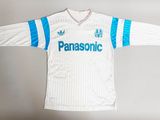 a white shirt with a blue and white stripe on it