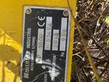 a yellow fire hydrant that has a sticker on it