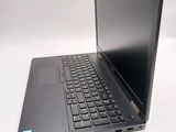 a laptop that is sitting on a white table
