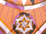 a colorful umbrella with a star of david on it