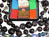 a black case with a bunch of different colored beads on it