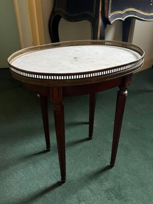 a table with a marble top on it in a room