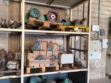 many different types of machinery on the shelves in the warehouse