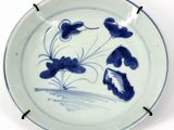 a blue and white plate with blue flowers on it