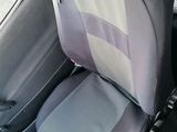 a car seat with a seat belt in the back of it