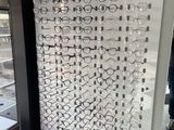 a display of glasses on a glass wall in a store