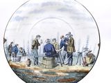 a plate with a painting of a group of people on it