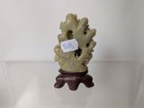 a small figurine that has a tag on it