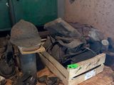 a pile of shoes and other items on a table