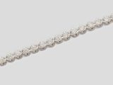 a close up of a diamond necklace on a white background