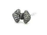 black and white diamond bow stud earrings on a white background