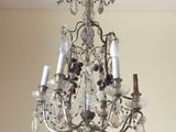 a chandelier hanging from the ceiling in a room