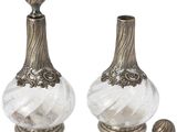 pair of antique silver and clear glass vases with a wooden stopper