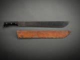 a knife that is sitting next to a piece of wood