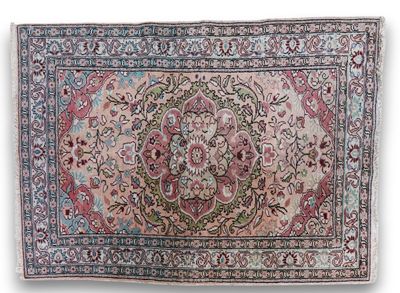 a rug with a floral design on a white background
