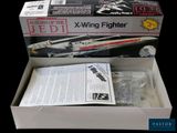 boxed picture of a box containing a model of a star wars jet
