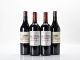 trois bouteilles de vin rouge posées l'une à côté de l'autre sur une surface blanche