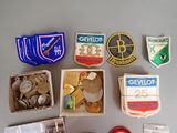 many different types of badges and badges on a table