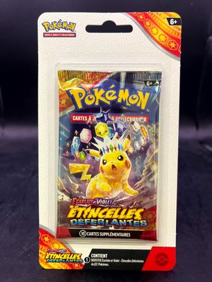a close up of a pokemon trading card in a package