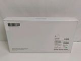 the back of a white box on a white surface with a barcode on it