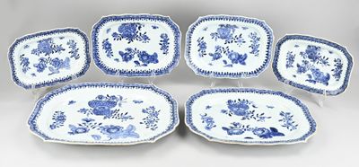 six blue and white plates with flowers and leaves on them